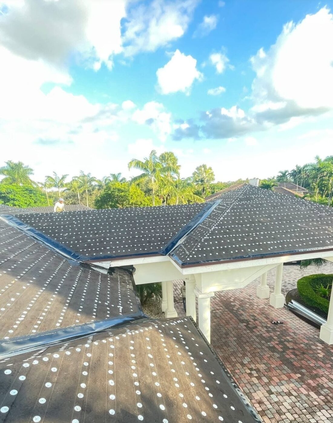 Roof underlayment installation in progress
