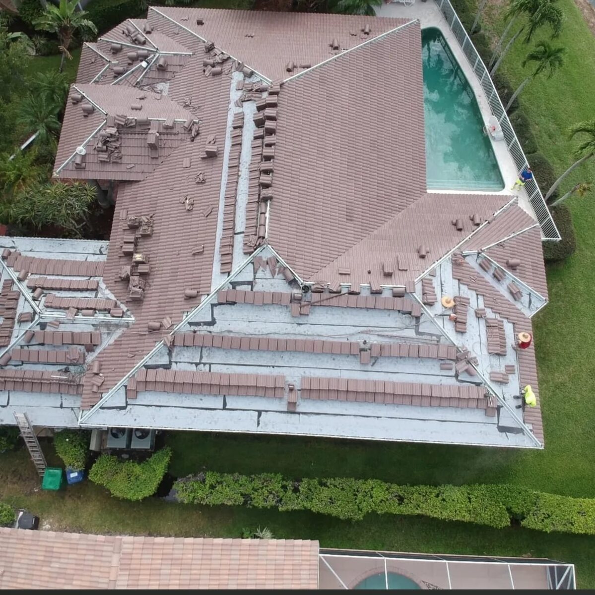 Aerial view of tile roof installation in progress