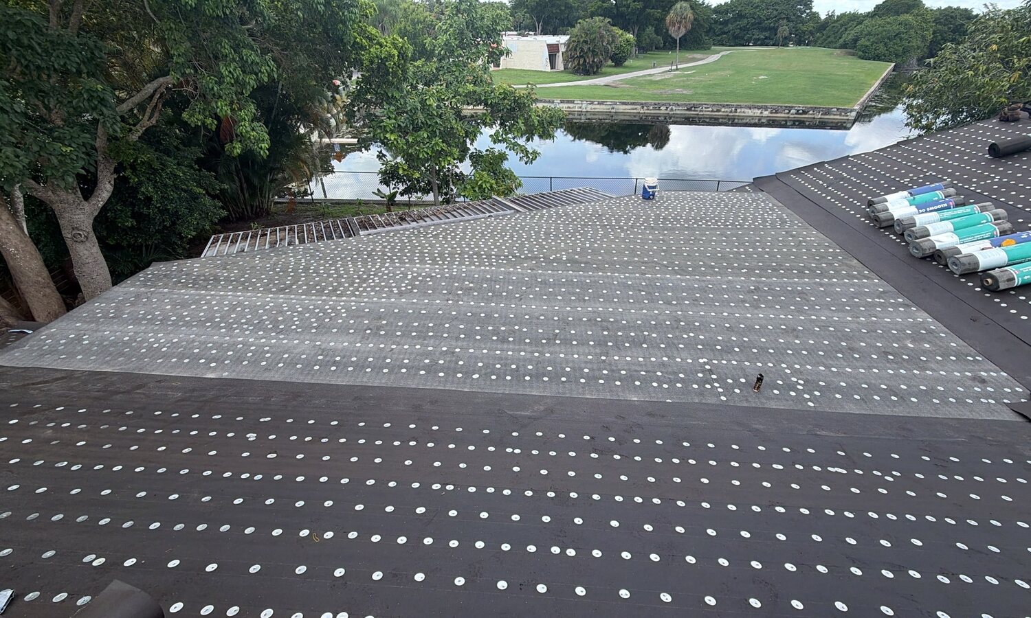 Waterproof underlayment fastened across a residential roof